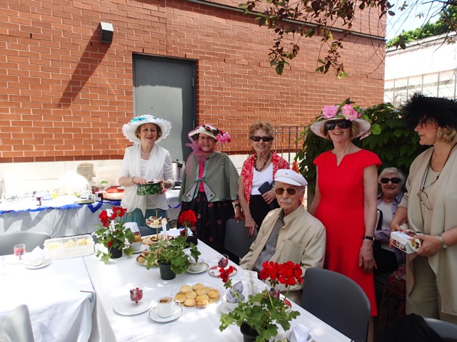 Timmy, Louise, Harriet, Donna, and Charlotte, Sharon and Sam (seated) pose for a photo
